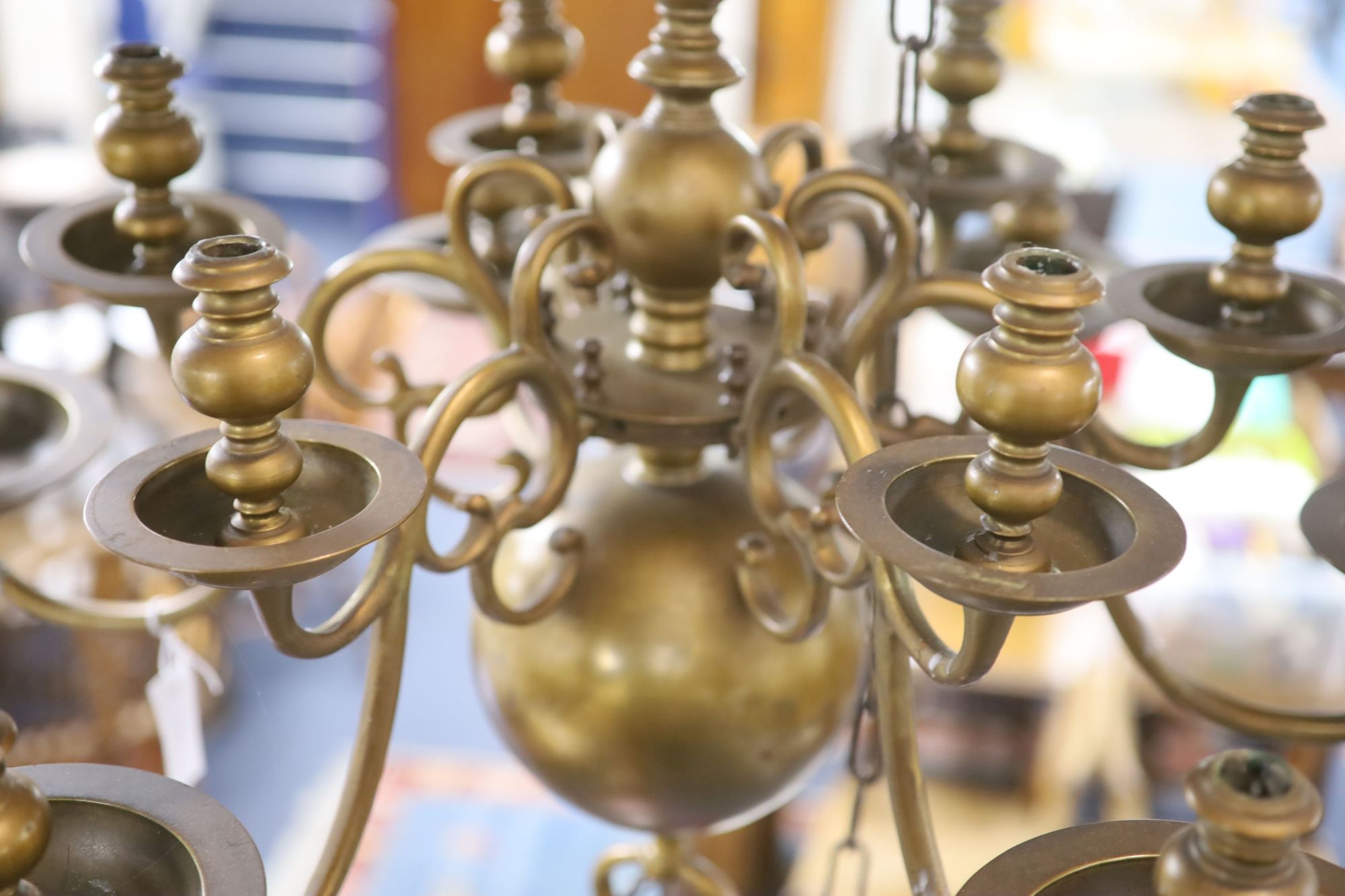 A 17th century style Dutch design brass six branch two tier ceiling chandelier